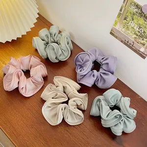 Set of 5 oversized satin scrunchies in Morandi colors with ruffled flower bud design