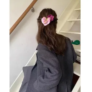Phalaenopsis orchid hair claw clip with realistic fabric flowers for elegant updos