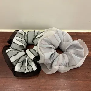 Striped organza scrunchies in black and grey, layered mesh fabric for bun hairstyles