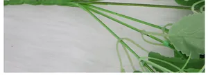 Macro detail of artificial bouquet stems showing realistic texture on white fur