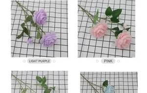Dettaglio di rose finte in seta viola chiaro e rosa con foglie verdi dall'aspetto reale