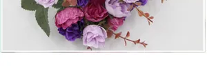 Detail shot of multi-colored artificial diamond roses with silk petals and realistic leaves