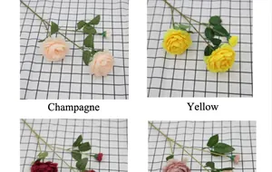 Primo piano di peonie artificiali champagne e gialle con petali di seta realistici