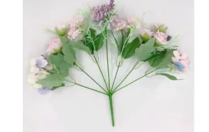 Detail showing artificial mixed bouquet of purple roses and white hydrangeas on white background