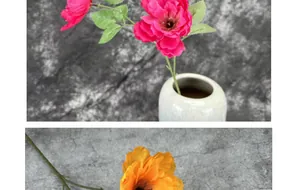 Künstliche Hibiskus-Seidenblumen in Rosa und Orange in weißer Keramikvase auf grauem Tisch