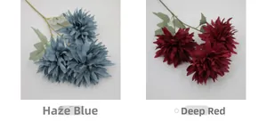 Detail of layered artificial chrysanthemum petals in dusty blue and deep red colors