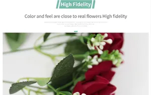 Close-up of artificial red silk roses with green leaves and small white flower buds