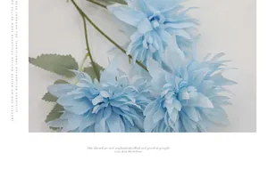 Macro detail of light blue artificial chrysanthemum with multi-layered silk petals