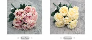 Detail view of artificial roses in dusty rose and champagne colors with green leaves