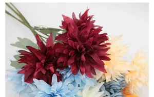 Detail of multi-colored artificial dahlia flowers with realistic layered silk petals