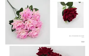 Detailed view of pink and red artificial silk roses with delicate greenery and white accents
