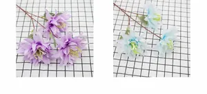 Detailed view of artificial silk dahlia flowers in purple and light blue with long stamens