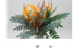 Detailed view of dark green and orange artificial locust leaves in a white ceramic vase
