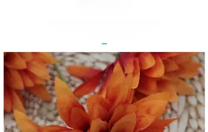 Detailed texture of lifelike orange gradient faux dahlia petals made of premium silk