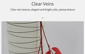 Detail van kunstmatige rode wilgenbladeren in een witte keramische vaas voor decor