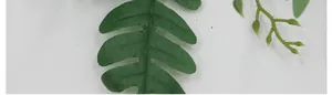 Macro shot showing realistic leaf texture and green fabric veins for floral arrangements