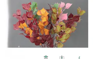 Detailed view of artificial bodhi leaves with clear textures and small red fruits
