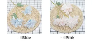 Detailed close-up showing pink and blue three-head dahlia flowers in artificial silk fabric