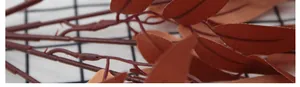 Detailed close-up of terracotta artificial willow leaves with realistic texture and veins