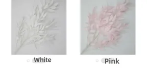 Detail view of artificial willow leaf branches in white and pink for wedding decor