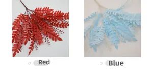Detail view of artificial locust leaves in red and blue colors for floral arrangements