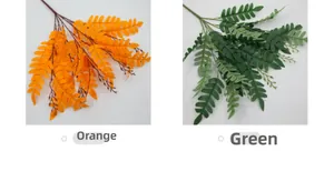 Detail view of artificial locust leaf branches in orange and green for floral design