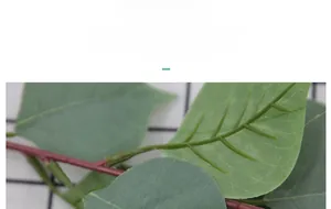 Macro detail of artificial green bodhi leaf showing realistic silk texture and veins