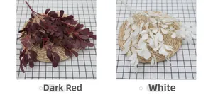 Detail view of artificial peanut leaves in dark red and white for home floral decor