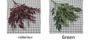 Detail view of artificial willow leaves in coffee red and green for floral arrangements