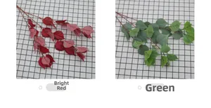 Detail view of artificial bodhi leaves in red and green colors for floral decoration