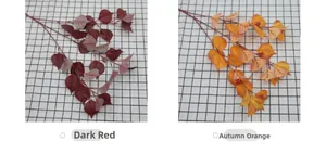 Detail view of artificial bodhi leaves in jujube red and autumn orange colors