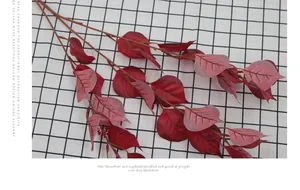Macro detail of artificial Bodhi leaves with realistic veins and red gradient texture