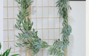 Detailed close-up of artificial willow vine leaves for minimalist home wall decor