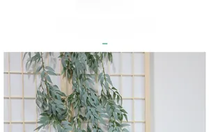 Detailed close-up showing the silk fabric leaf texture of the artificial willow vine