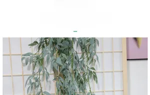 Detail of grey-green artificial eucalyptus vines hanging on a wooden lattice background