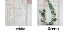 Detail of artificial willow leaf vines in white and green on a wooden trellis background