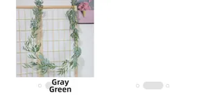 Detailed view of gray-green artificial willow leaf vines hanging on a wooden trellis