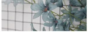 Detail of Morandi-toned artificial orchid petals with silk texture and plastic stems