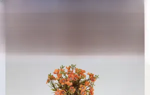 Macro detail of artificial mini hydrangea bouquet with orange petals for home decor