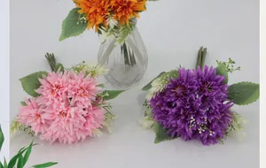 Close-up of lifelike African daisies in pink, purple, and orange with realistic petals