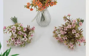 Detailed top view of realistic artificial hydrangea silk flowers in a glass vase