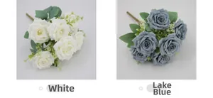Detailed comparison of artificial white and dusty blue Austin roses with silk petals