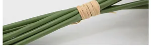 Detail of artificial hydrangea stems tied with natural raffia for home floral decor
