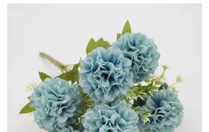 Detailed view of Morandi blue faux hydrangea bouquet with realistic petals and foliage
