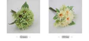 Detail view of artificial African daisies in green and white colors with realistic petals