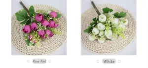 Detail of faux mini tea roses in rose red and white silk fabric for wedding decor