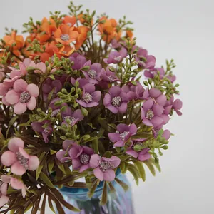Artificial oil painting hydrangea bouquet with silk flowers in a blue glass vase