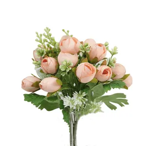 Artificial tea rose bouquet with pink silk buds and green leaves for wedding decor