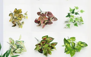 Close-up of various artificial green plant leaves with realistic textures and colors