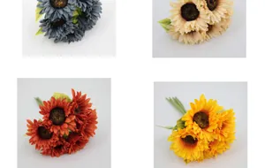 Detail of artificial sunflower bouquet in four colors including blue, cream and orange